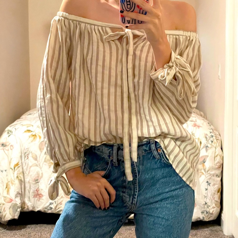 Off the shoulder cream and tan striped blouse.